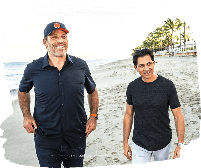Tony Robbins and Dean Graziosi on a beach